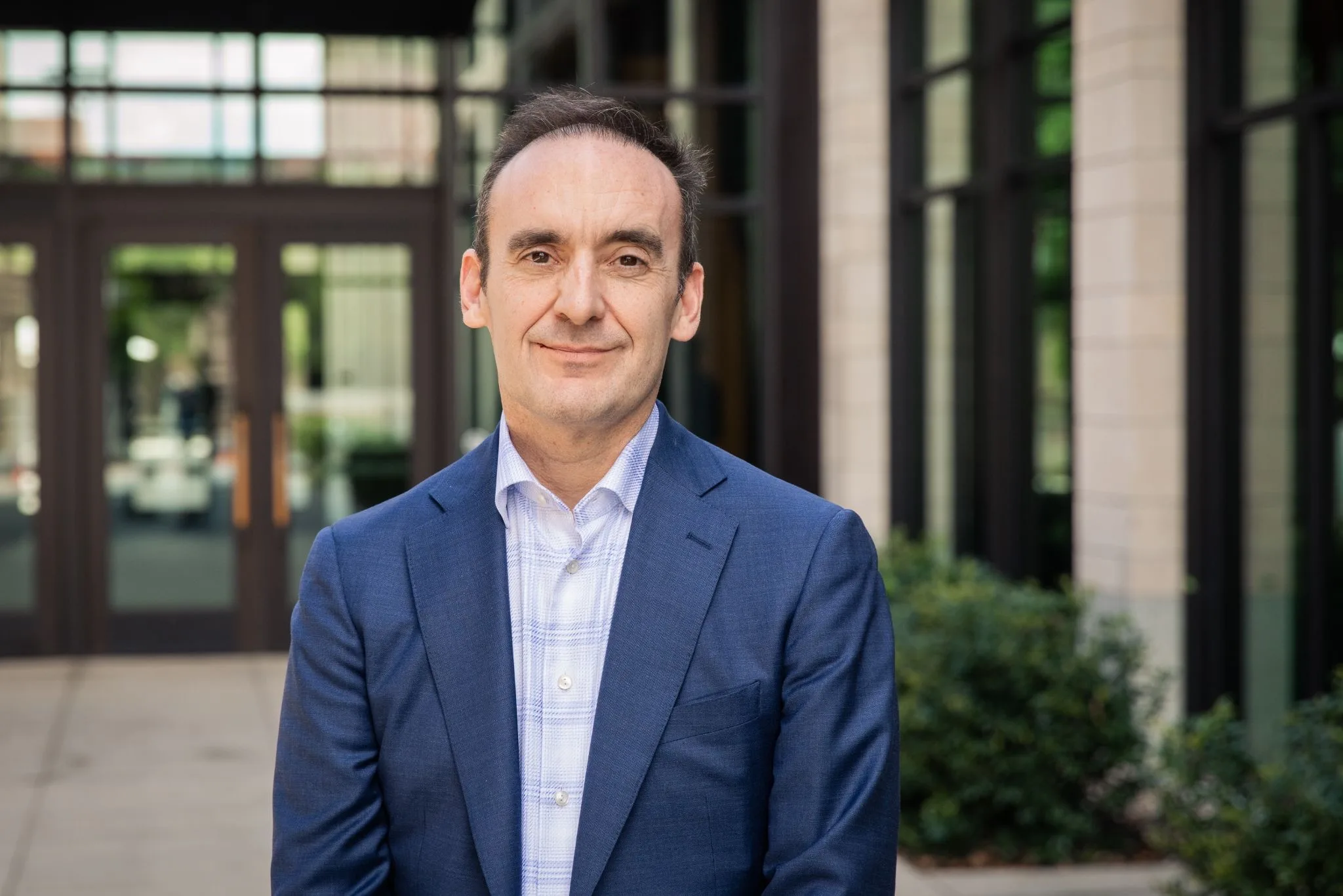 Chris Raggio, co-founder of Biotic, photographed outside an office building